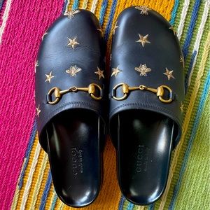 Gucci never worn outside size W11 clogs. Comes with shoe sleeves for each shoe.